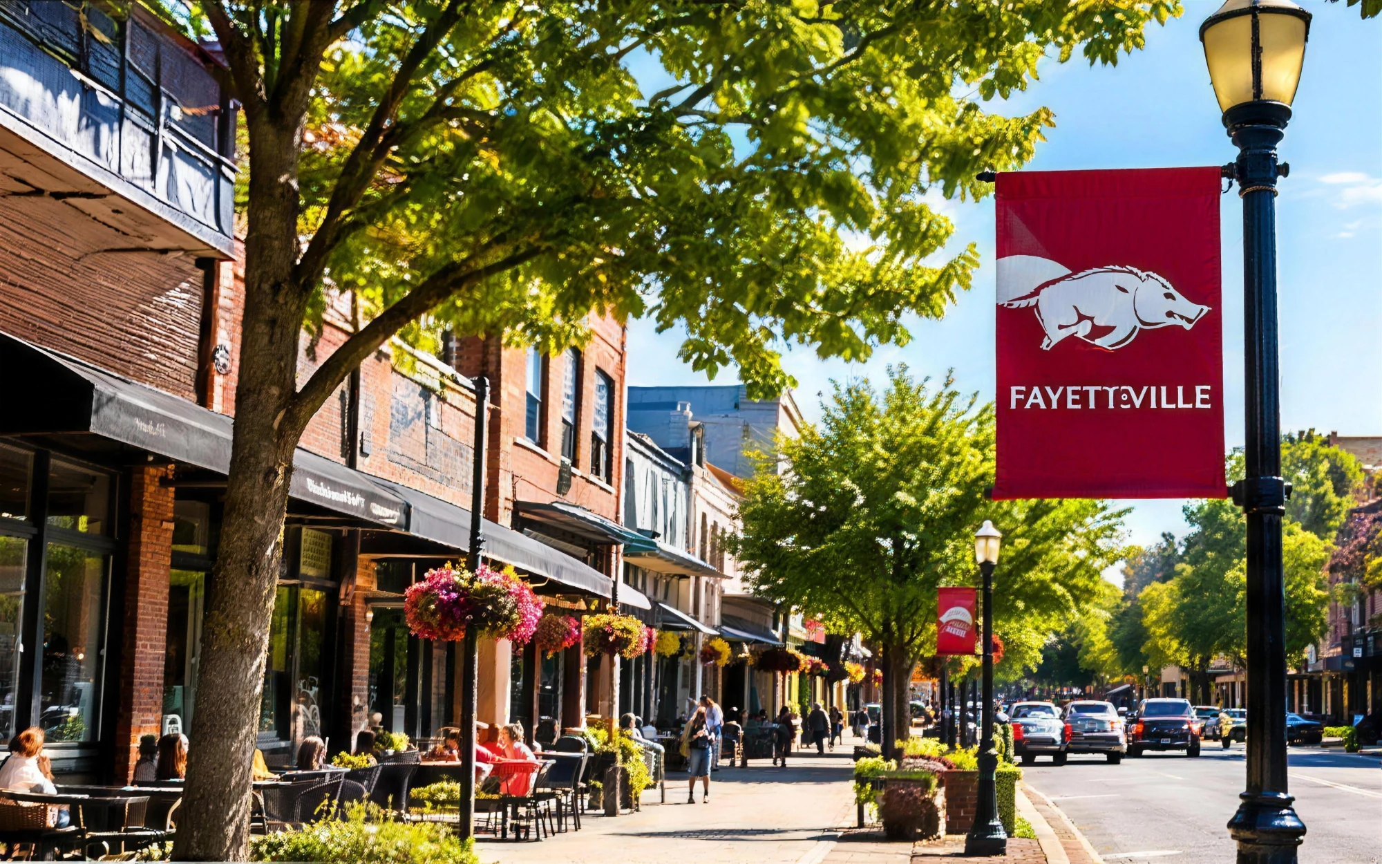 Tree-lined downtown street with shops and cafés in Fayetteville, Arkansas